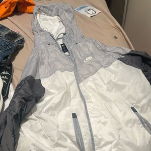 Nike Windrunner with free pair of ripped jeans